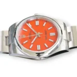 Rolex 124300-0007 coral red lacquer dial white gold baton markers Chromalight hands pristine close-up