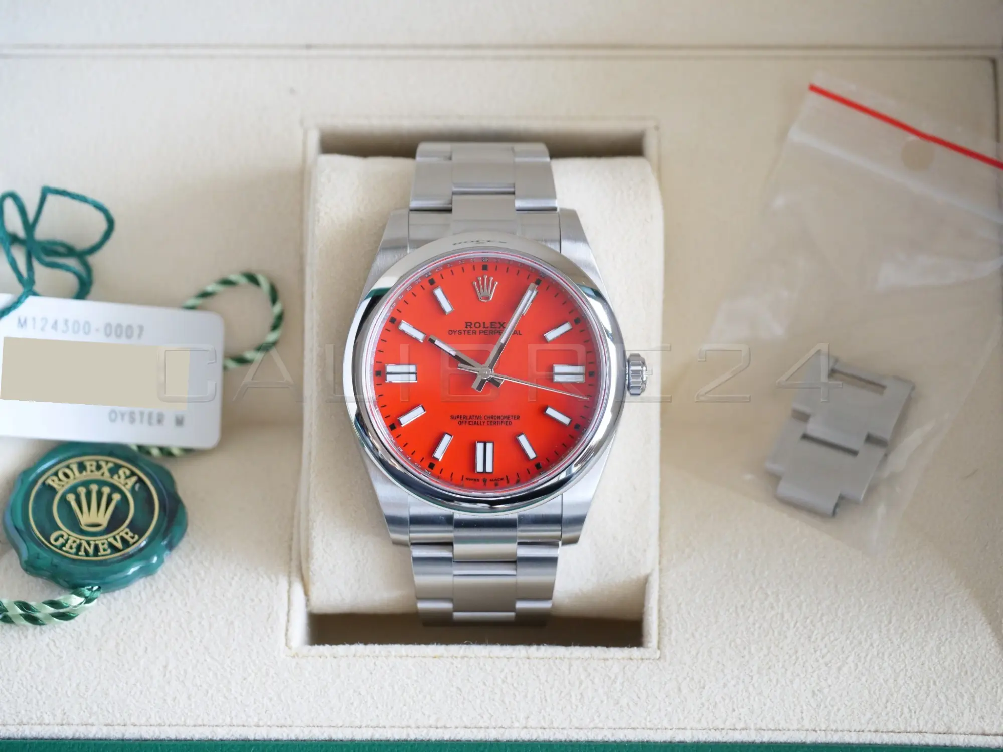 Rolex 124300-0007 coral red discontinued full set box white serial hang tag warranty card papers Calibre24 Perth
