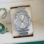 Rolex Oyster Perpetual 41 silver 124300-0001 2023 mint full set box green warranty card papers Calibre24 Pert