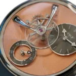 MB&F LM101 EVO salmon CVD dial plate arabesque brushing 14mm flying balance wheel twin mirror arch close-up