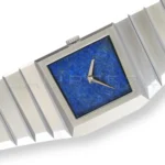 Toledano & Chan B/1 brutalist asymmetric 904L steel case — side profile showing faceted planes and left-side crown